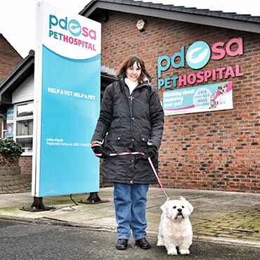 Sue and her dog George outside the PDSA